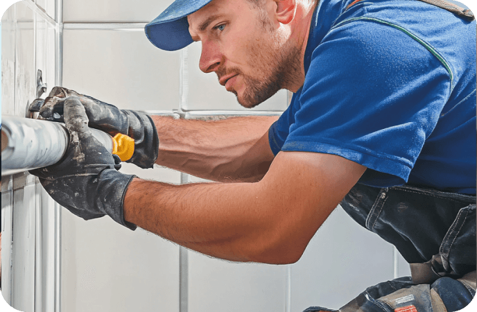 Certified plumber installing the pipe