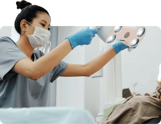 Dentist examining a patient's during a dental check-up, providing professional oral care in a modern clinic.